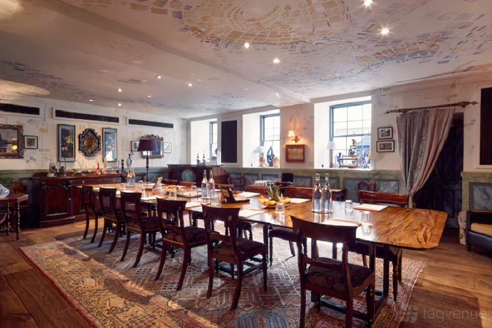 The teaching room at The Zetter Clerkenwell, long tables under an ornate ceiling