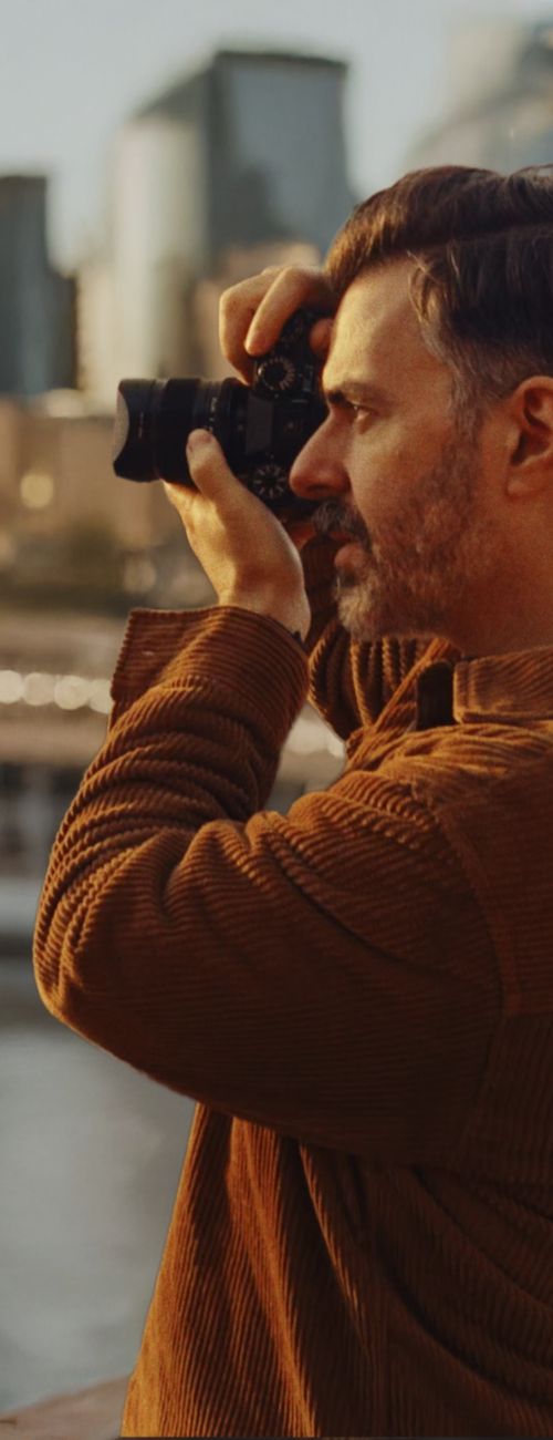 Shane Taylor photographing on a street